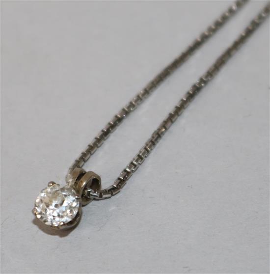 A white metal and solitaire diamond pendant, on an 18ct white gold fine link chain.